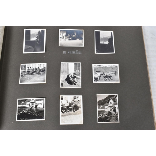 211 - TWO 1936 BERLIN OLYMPIC ALBUMS OF PHOTOGRAPHS, ticket stubs, stamped postcards, the first album cont... 