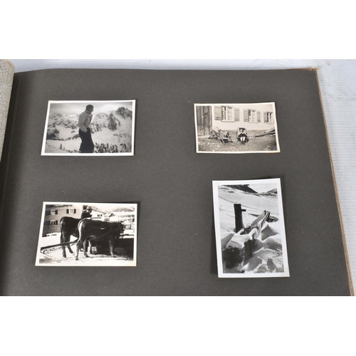 211 - TWO 1936 BERLIN OLYMPIC ALBUMS OF PHOTOGRAPHS, ticket stubs, stamped postcards, the first album cont... 