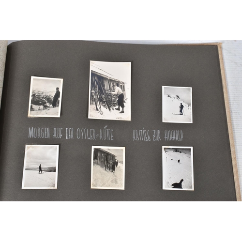 211 - TWO 1936 BERLIN OLYMPIC ALBUMS OF PHOTOGRAPHS, ticket stubs, stamped postcards, the first album cont... 