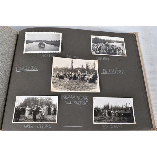 211 - TWO 1936 BERLIN OLYMPIC ALBUMS OF PHOTOGRAPHS, ticket stubs, stamped postcards, the first album cont... 