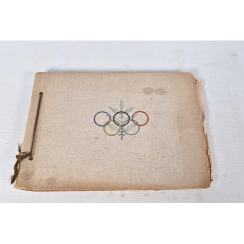 211 - TWO 1936 BERLIN OLYMPIC ALBUMS OF PHOTOGRAPHS, ticket stubs, stamped postcards, the first album cont... 