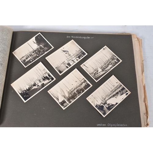 211 - TWO 1936 BERLIN OLYMPIC ALBUMS OF PHOTOGRAPHS, ticket stubs, stamped postcards, the first album cont... 