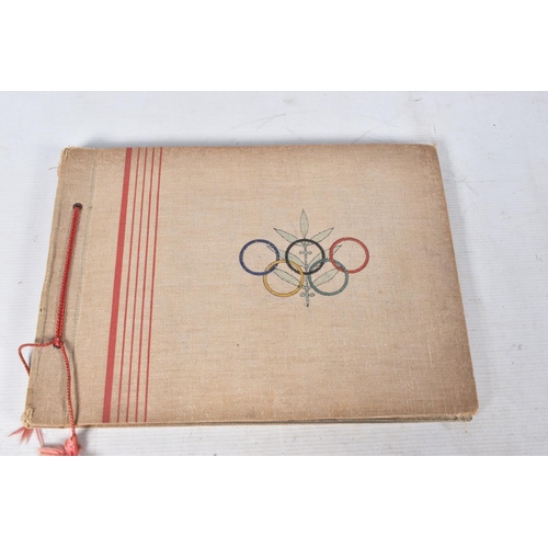 211 - TWO 1936 BERLIN OLYMPIC ALBUMS OF PHOTOGRAPHS, ticket stubs, stamped postcards, the first album cont... 