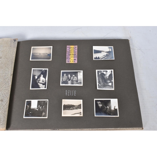 211 - TWO 1936 BERLIN OLYMPIC ALBUMS OF PHOTOGRAPHS, ticket stubs, stamped postcards, the first album cont... 