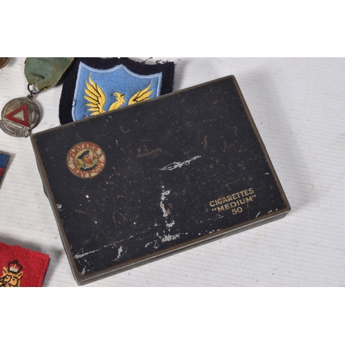 221 - A SELECTION OF BRITISH AND FRENCH MILITARY RELATED ITEMS, to include, three WWII medals, safe drivin... 