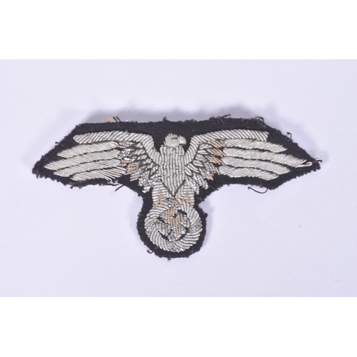 231 - A THIRD REICH GERMANY SS OFFICERS TUNIC SLEEVE EAGLE, this is hand embroidered with silver bullion, ... 