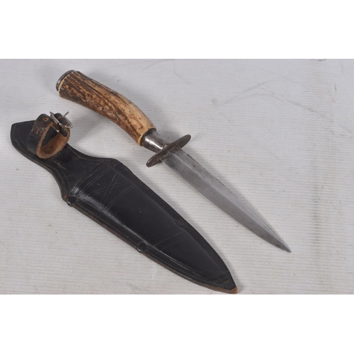 236 - TWO GERMAN BONE/HORN HANDLED DAGGERS, the first is unmarked on the blade and comes in a leather scab... 