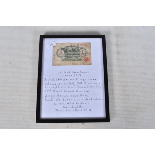 242 - A GERMAN WWI BANK NOTE AND A PHOTO OF A SOLDIER, the bank note is framed and on one side says on a d... 