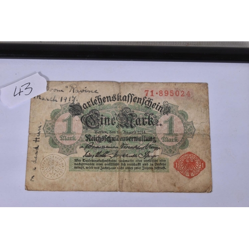 242 - A GERMAN WWI BANK NOTE AND A PHOTO OF A SOLDIER, the bank note is framed and on one side says on a d... 