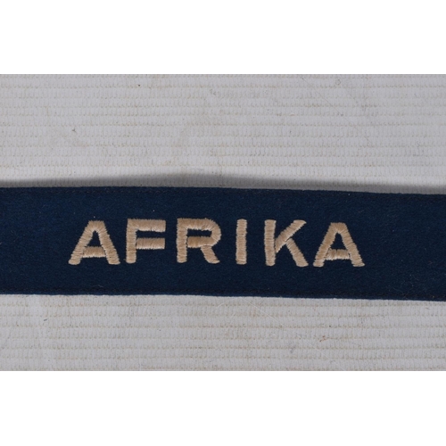 243 - A GERMAN THIRD REICH LUFTWAFFE AFRIKA CUFF TITLE, this a blue with machine embroidered letters, it m... 