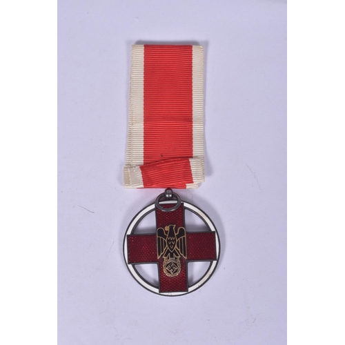 245 - A GERMAN CROSS OF HONOUR OF THE GERMAN RED CROSS, this features a loop at the top and a length of ri... 