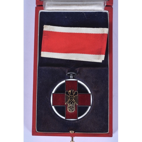 245 - A GERMAN CROSS OF HONOUR OF THE GERMAN RED CROSS, this features a loop at the top and a length of ri... 