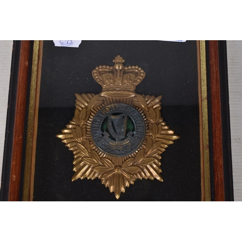 268 - A CONNOUGHT RANGERS HELMET PLATE, this is framed and mounted and the helmet plate features a gilt cr... 