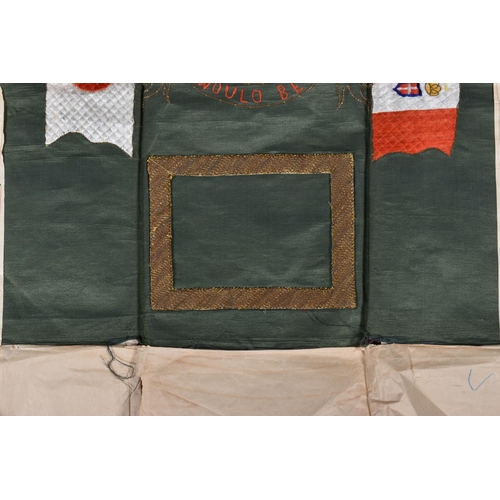 271 - A WWI CLOTH MEMORIAL WALL DISPLAY, this is un-framed and features a green cloth background and a lio... 