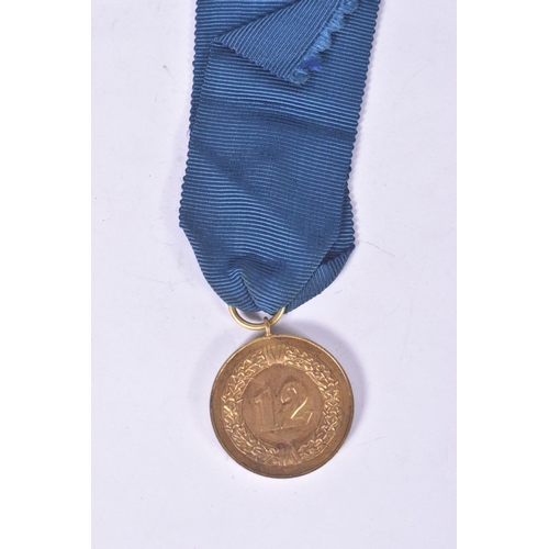 282 - A GERMAN LUFTWAFFE TWELVE YEAR LONG SERVICE MEDAL, the blue ribbon still has the eagle emblem fitted... 