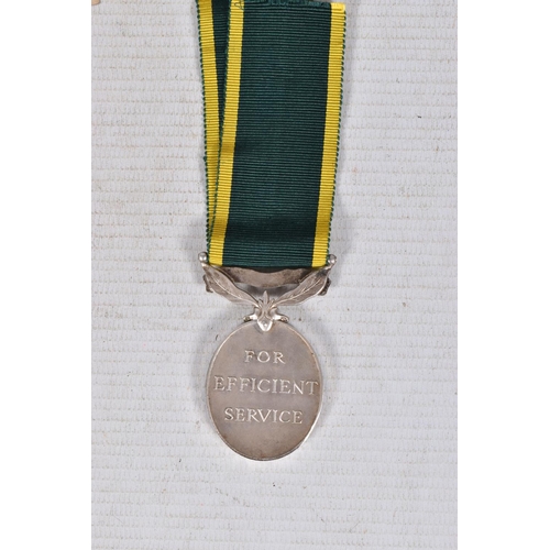 291 - A WWII AND TERRATORIAL EFFICIANCY MEDAL GROUP AND PAPERWORKS, the medals are 1939-45 star and war me... 