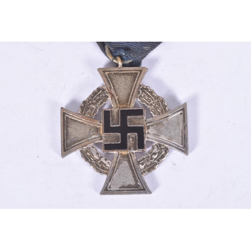 300 - A THIRD REICH GERMAN TWENTY FIVE YEAR FAITHFUL SERVICE CROSS, this cross is silvered with an enamel ... 