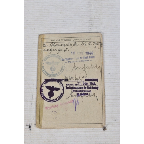 304 - A COLLECTION OF GERMAN WWII DOCUMENTS, to include rations cards, a newspaper print dated 02/05/1945,... 