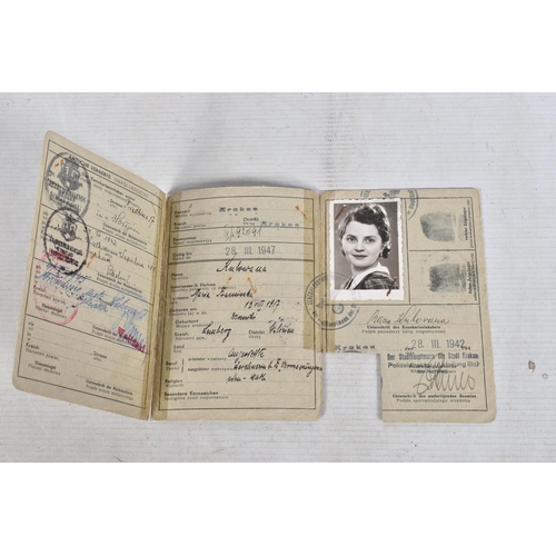 304 - A COLLECTION OF GERMAN WWII DOCUMENTS, to include rations cards, a newspaper print dated 02/05/1945,... 