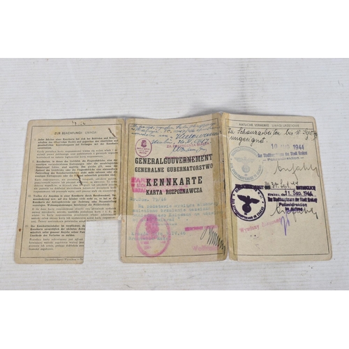 304 - A COLLECTION OF GERMAN WWII DOCUMENTS, to include rations cards, a newspaper print dated 02/05/1945,... 