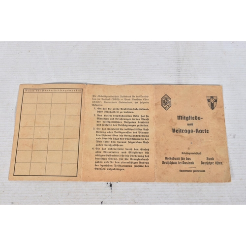 304 - A COLLECTION OF GERMAN WWII DOCUMENTS, to include rations cards, a newspaper print dated 02/05/1945,... 