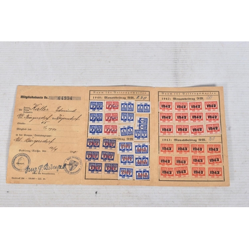 304 - A COLLECTION OF GERMAN WWII DOCUMENTS, to include rations cards, a newspaper print dated 02/05/1945,... 