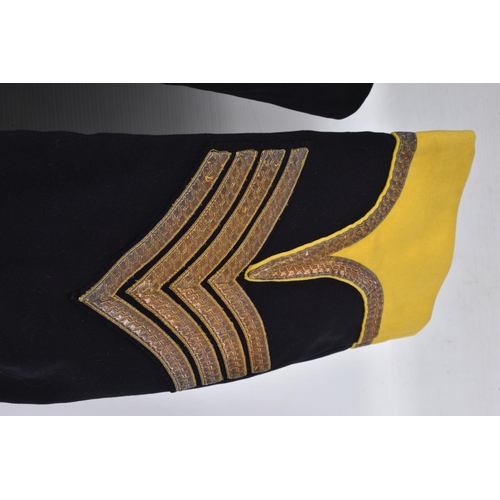 309 - A PRE WWI STYLE MILITARY JACKET, the jacket is dark blue and yellow with gold colour brading around ... 