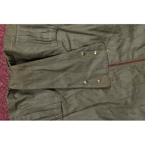 310 - A WWII DATED 1942 AIRBORNE LONG OVERSMOCK, this is sleeveless and green in colour, this features the... 