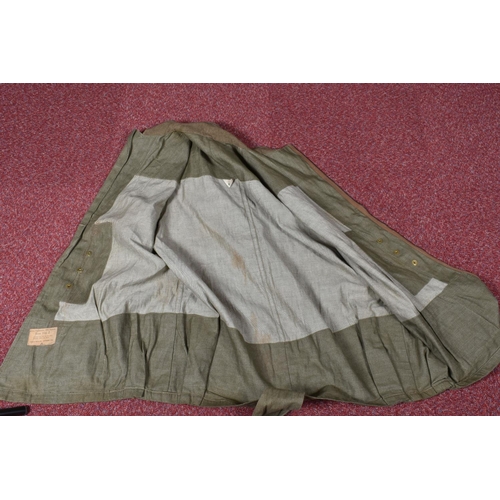 310 - A WWII DATED 1942 AIRBORNE LONG OVERSMOCK, this is sleeveless and green in colour, this features the... 