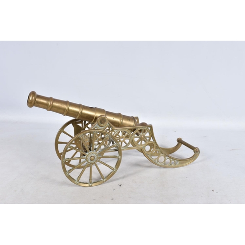 311 - A SELECTION OF MILITARY RELATED ITEMS, to include four  brass cannons, the sticks and two shell case... 