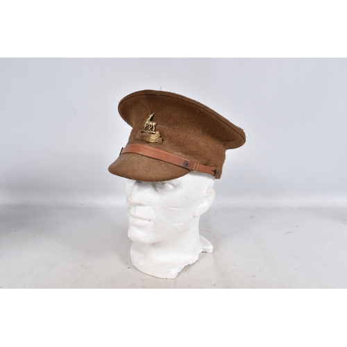 317 - A SELECTION OF WWII ERA AND LATER MILITARY HATS, this lot includes a steel helmet dated 1940 with ne... 