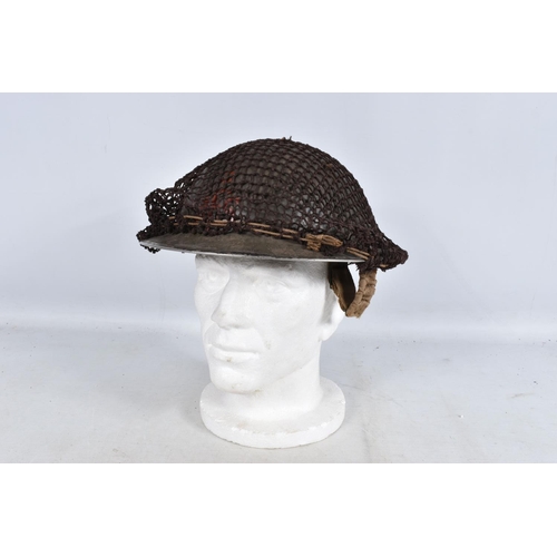 317 - A SELECTION OF WWII ERA AND LATER MILITARY HATS, this lot includes a steel helmet dated 1940 with ne... 