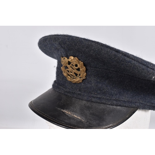 317 - A SELECTION OF WWII ERA AND LATER MILITARY HATS, this lot includes a steel helmet dated 1940 with ne... 