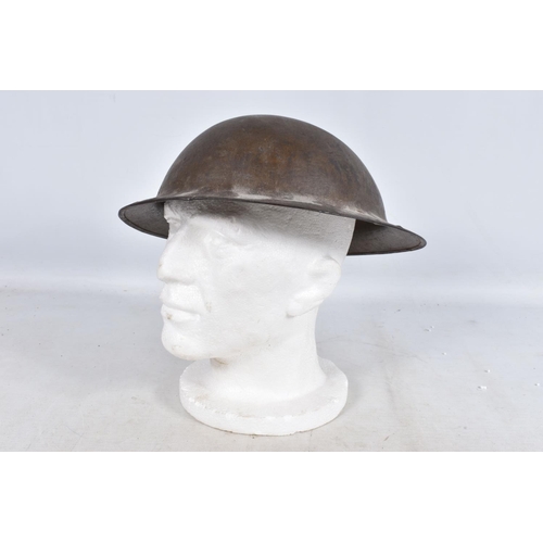 317 - A SELECTION OF WWII ERA AND LATER MILITARY HATS, this lot includes a steel helmet dated 1940 with ne... 