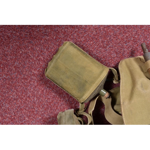 325 - A SET OF MILITARY WEBBING AND OTHER ASSOCIATED ITEMS, the webbing kit include a two piece entrenchin... 