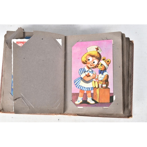 368 - POSTCARDS, Two unusual albums containing approximately 100 Postcards, examples include cartoons or p... 