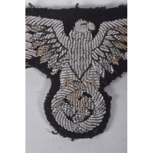 231 - A THIRD REICH GERMANY SS OFFICERS TUNIC SLEEVE EAGLE, this is hand embroidered with silver bullion, ... 