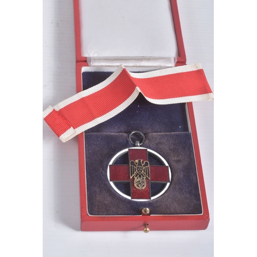 245 - A GERMAN CROSS OF HONOUR OF THE GERMAN RED CROSS, this features a loop at the top and a length of ri... 