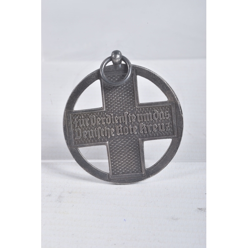 245 - A GERMAN CROSS OF HONOUR OF THE GERMAN RED CROSS, this features a loop at the top and a length of ri... 