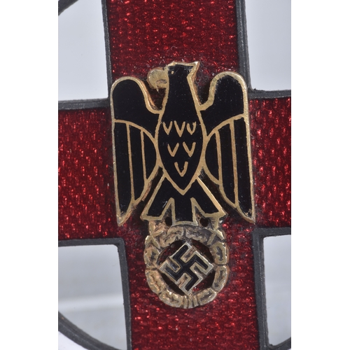 245 - A GERMAN CROSS OF HONOUR OF THE GERMAN RED CROSS, this features a loop at the top and a length of ri... 