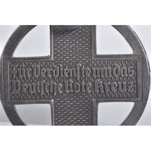 245 - A GERMAN CROSS OF HONOUR OF THE GERMAN RED CROSS, this features a loop at the top and a length of ri... 