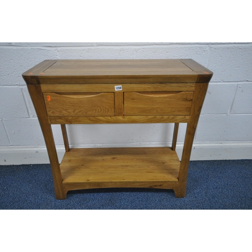 1258 - A LIGHT OAK SIDE TABLE, with two drawers, and undershelf, width 85cm x depth 35cm x height 78cm (con... 