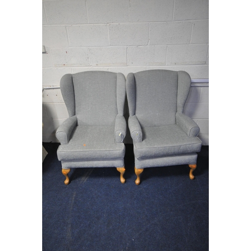 1395 - A PAIR OF GREY UPHOLSTERED WING BACK ARMCHAIRS, on beech legs (2)