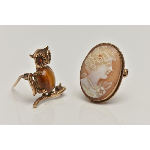 139 - TWO 9CT GOLD BROOCHES, the first brooch designed as an owl with an oval cabochon tigers eye to the b... 