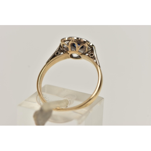 173 - A YELLOW AND WHITE METAL CLUSTER RING, flower shape cluster set with a central circular cut sapphire... 