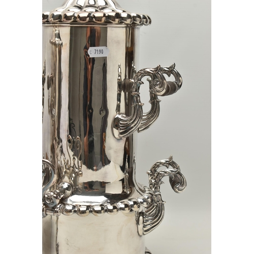 224 - TWO SILVER PLATE SAMOVAR, the first a samovar decorated with four acanthus leaf and carved ebony han... 