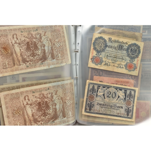 227 - TWO ALBUMS OF COINS, STAMPS, BANKNOTES, ETC, to include an album 1 Four Sheets of WWII Related coina... 