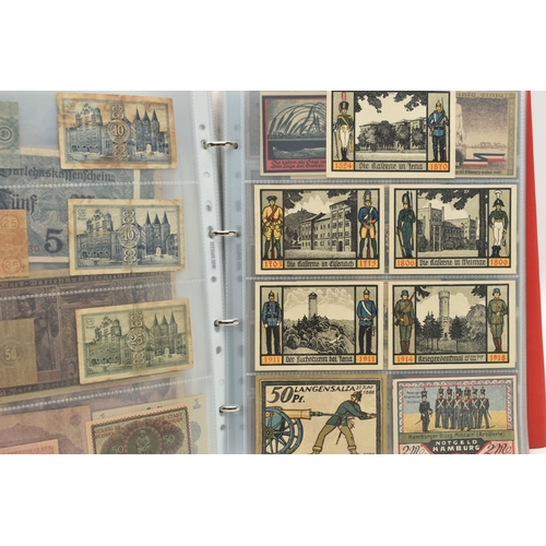 227 - TWO ALBUMS OF COINS, STAMPS, BANKNOTES, ETC, to include an album 1 Four Sheets of WWII Related coina... 