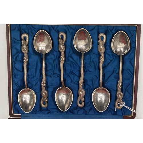 242 - A CASED SET OF SIX JAPANESE NAGASAKI TEA SPOONS, white metal teaspoons with etched detail and serpen... 