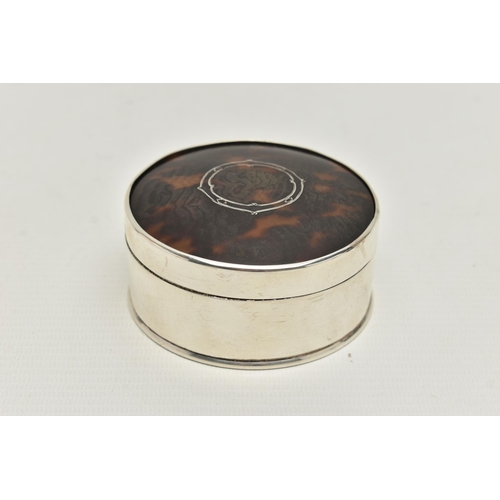 244 - AN EARLY 20TH CENTURY SILVER AND TORTOISESHELL TRINKET BOX, of circular outline with gilded interior... 